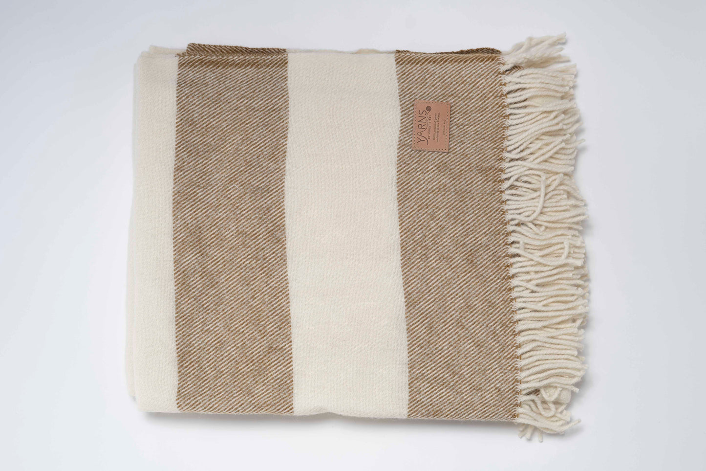 Woven blanket with Clay and white stripes on a white background