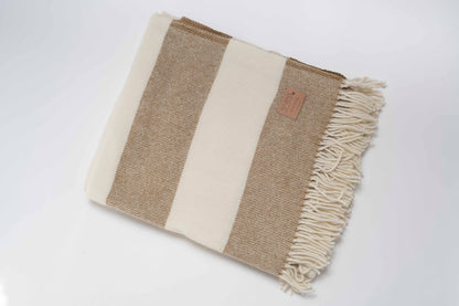 Clay and White striped blanket with fringes on a white background